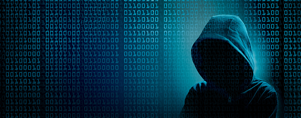 Cyber criminal in a black hoodie